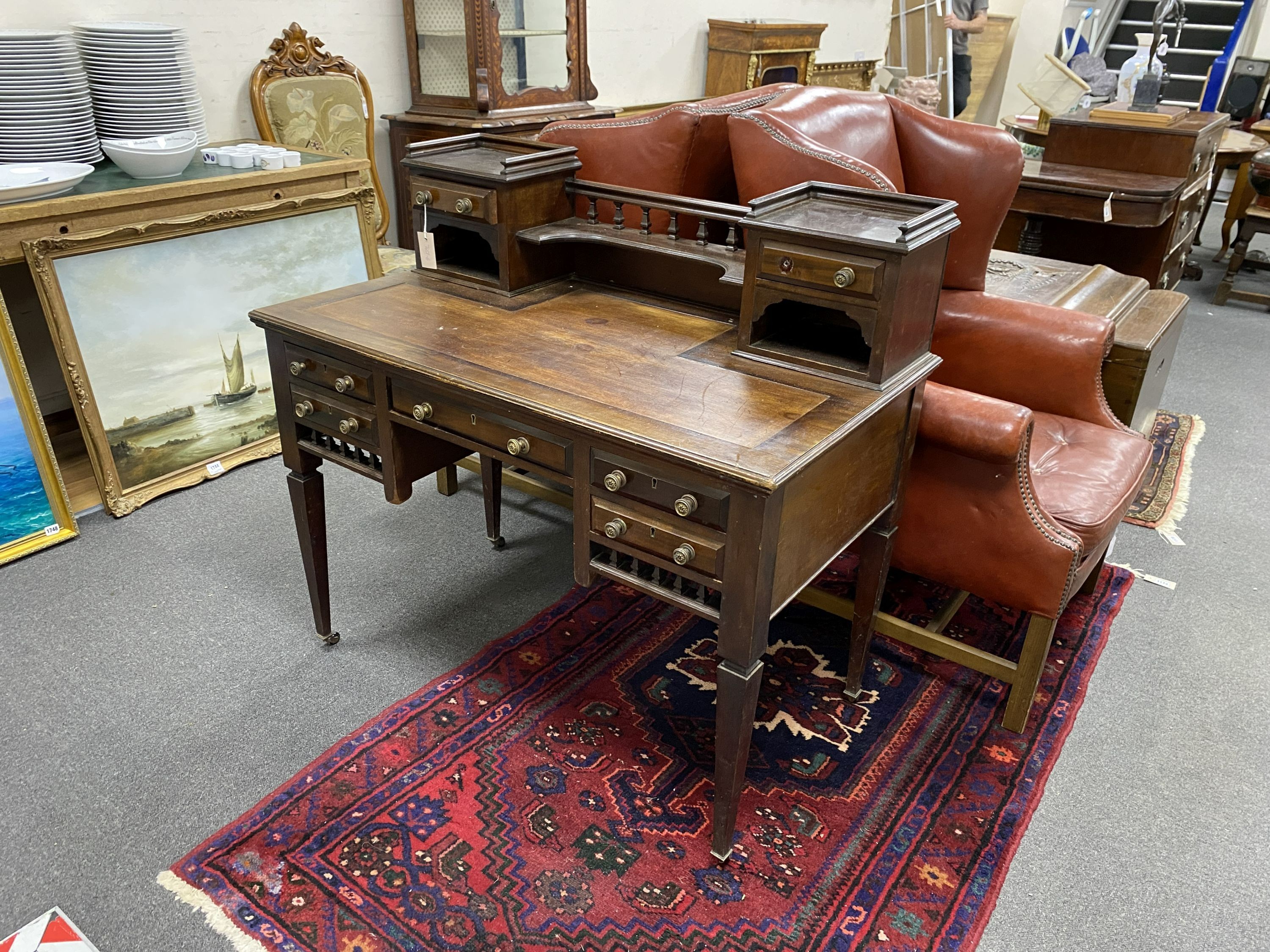 An Edwardian kneehole writing table, width 107cm, depth 60cm, height 100cm